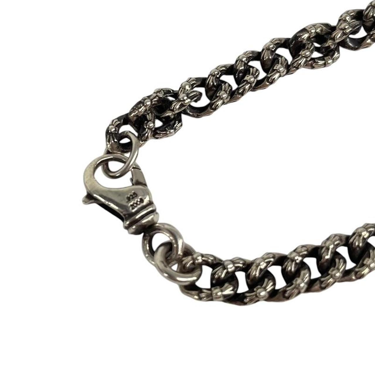 Chrome Hearts silver bracelet with intricate link design and logo detailing.