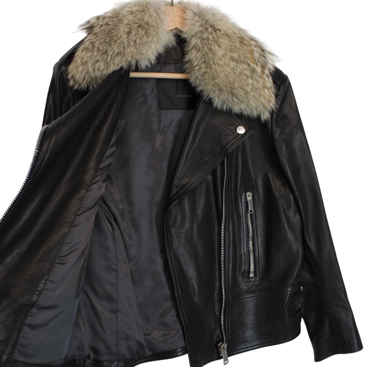 Belstaff black leather biker jacket with detachable coyote fur collar and logo detailing.
