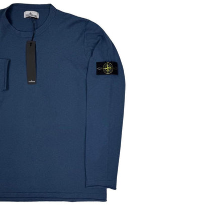 Stone Island blue organic cotton knit jumper with logo patch and ribbed detailing.