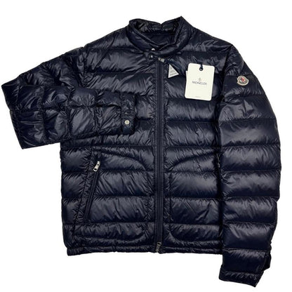 Moncler navy blue down jacket with full zip and logo patch on sleeve.