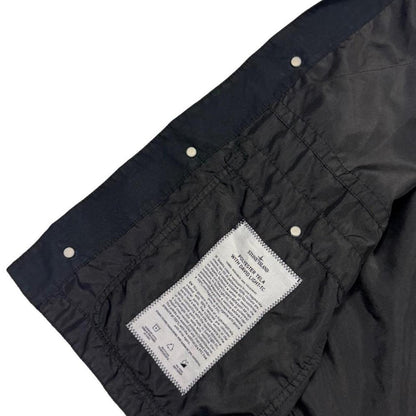 Stone Island black vest jacket, lightweight polyester, logo patch on chest.