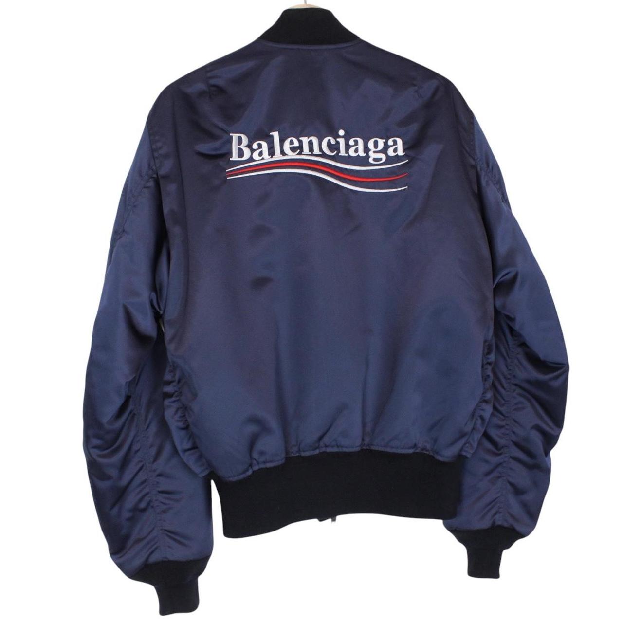 Balenciaga navy bomber jacket with full zip and campaign logo on chest.