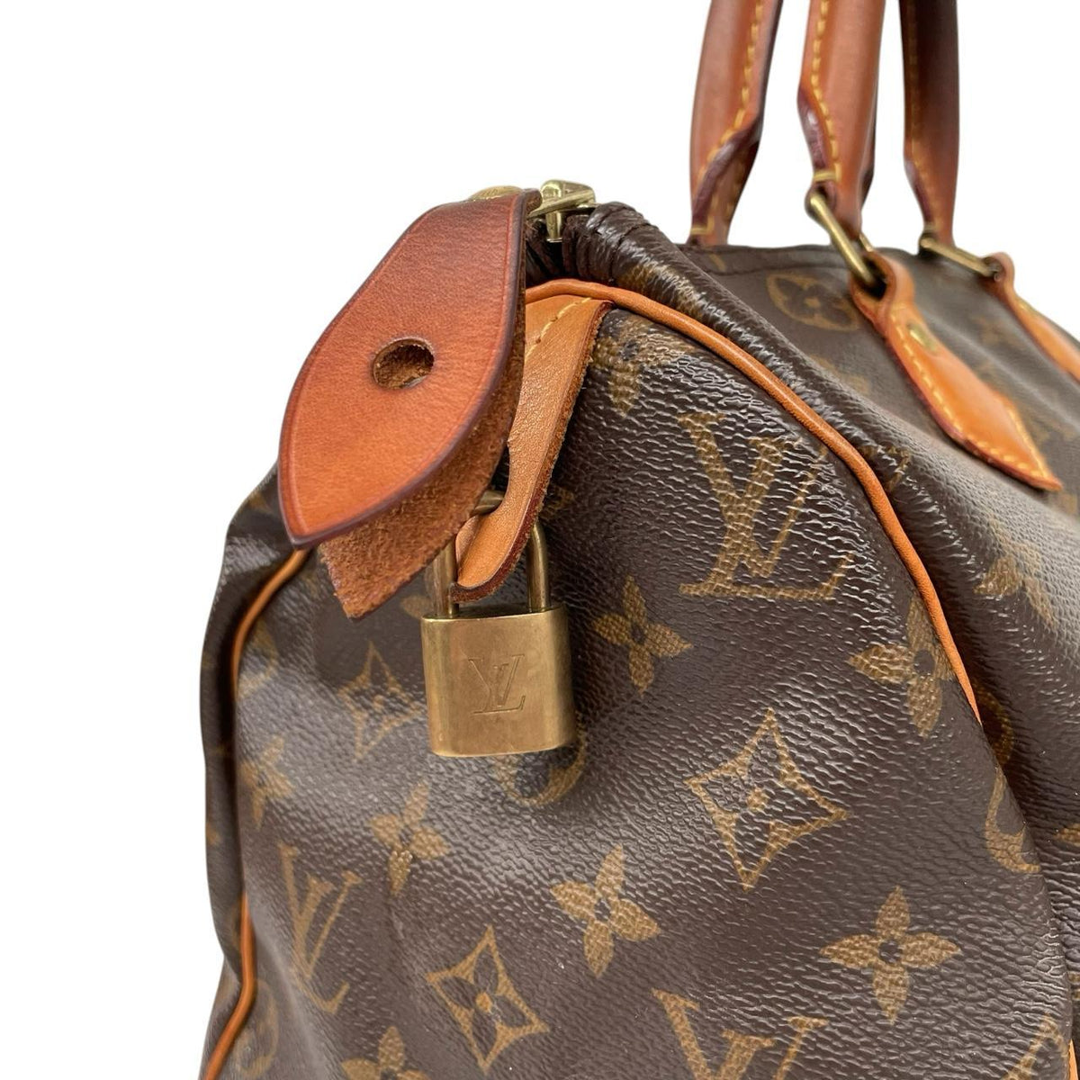 Louis Vuitton beige and brown monogram coated canvas shopping tote with padlock detail.