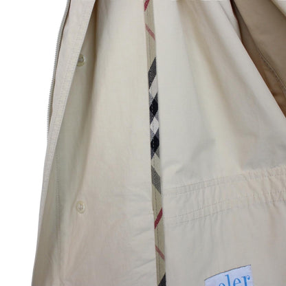 Burberry beige coat with classic check pattern and logo detail on collar.