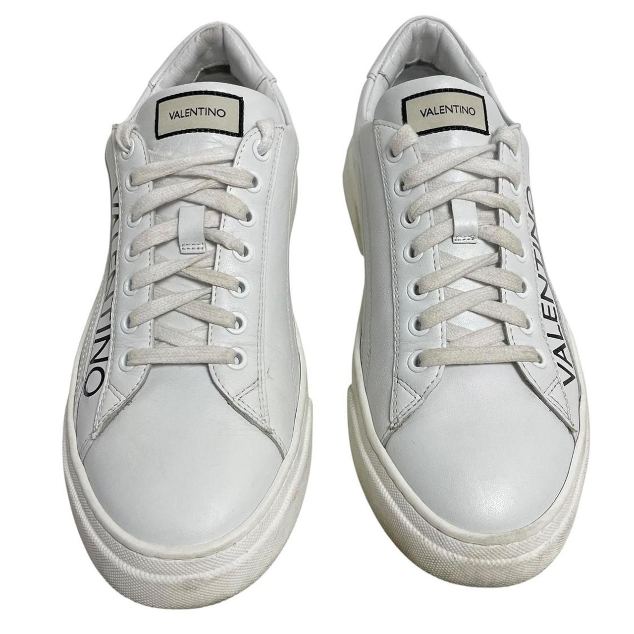Valentino black and white trainers calfskin leather with logo detail and scuffed soles.