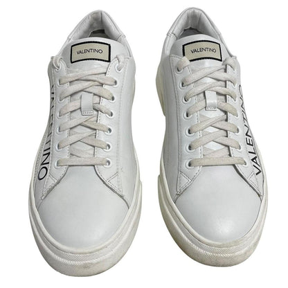 Valentino black and white trainers calfskin leather with logo detail and scuffed soles.