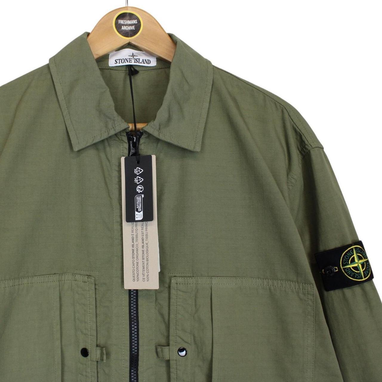 Stone Island green ripstop full zip overshirt jacket with logo patch and cotton material.