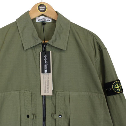 Stone Island green ripstop full zip overshirt jacket with logo patch and cotton material.