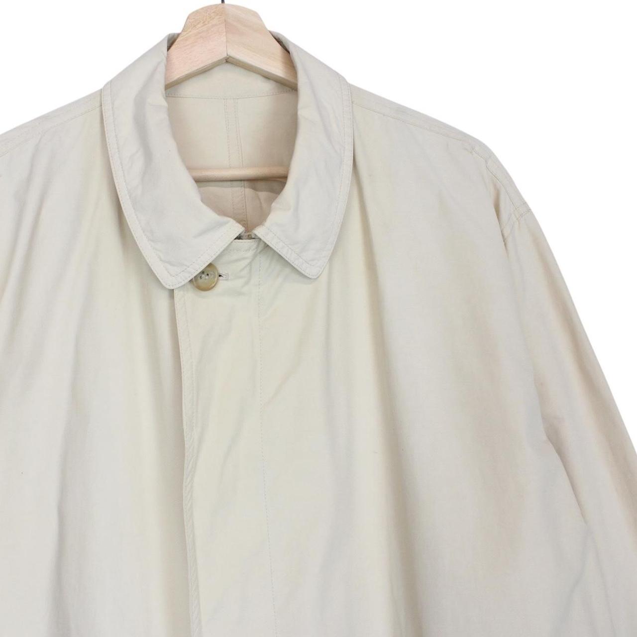 Burberry beige coat with classic check pattern and logo detail on collar.