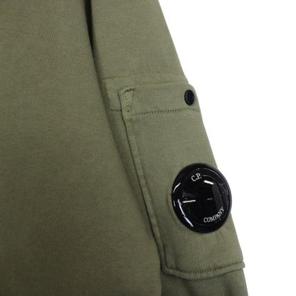CP Company green sweatshirt diagonal fleece with signature lens detail and logo.