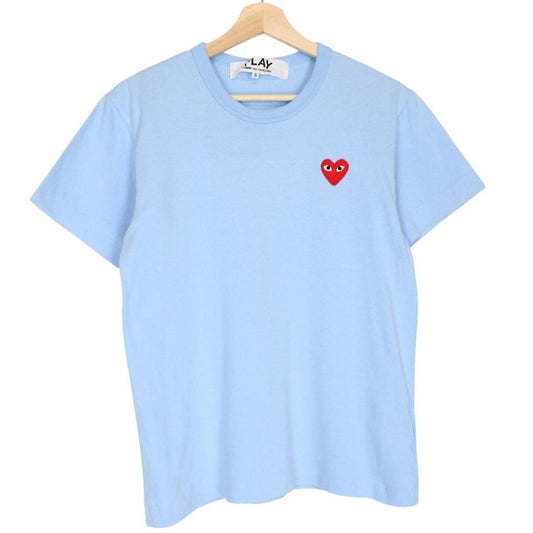 Comme des Garcons light blue short sleeve cotton t-shirt with heart logo and pocket.