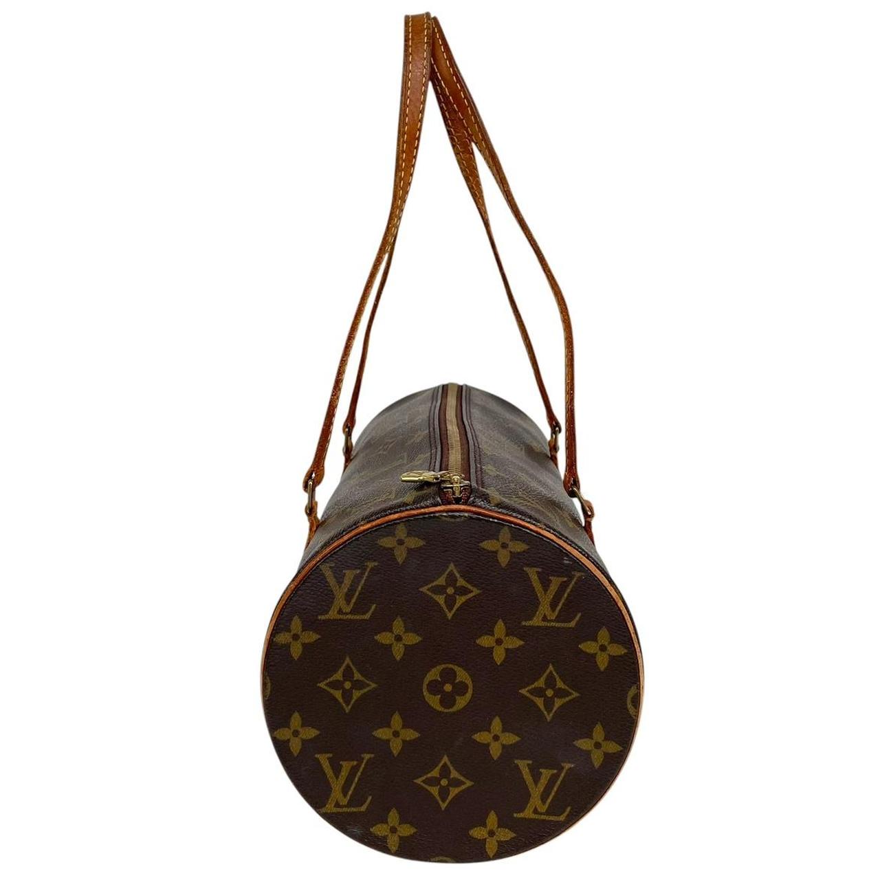 Louis Vuitton duffel bag brown and tan monogram canvas with logo and piping details.