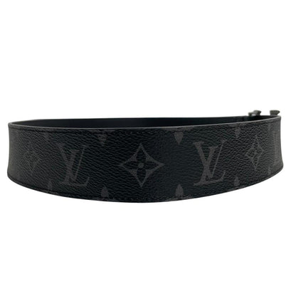 Louis Vuitton black canvas belt with LV monogram pattern and gold-tone buckle.