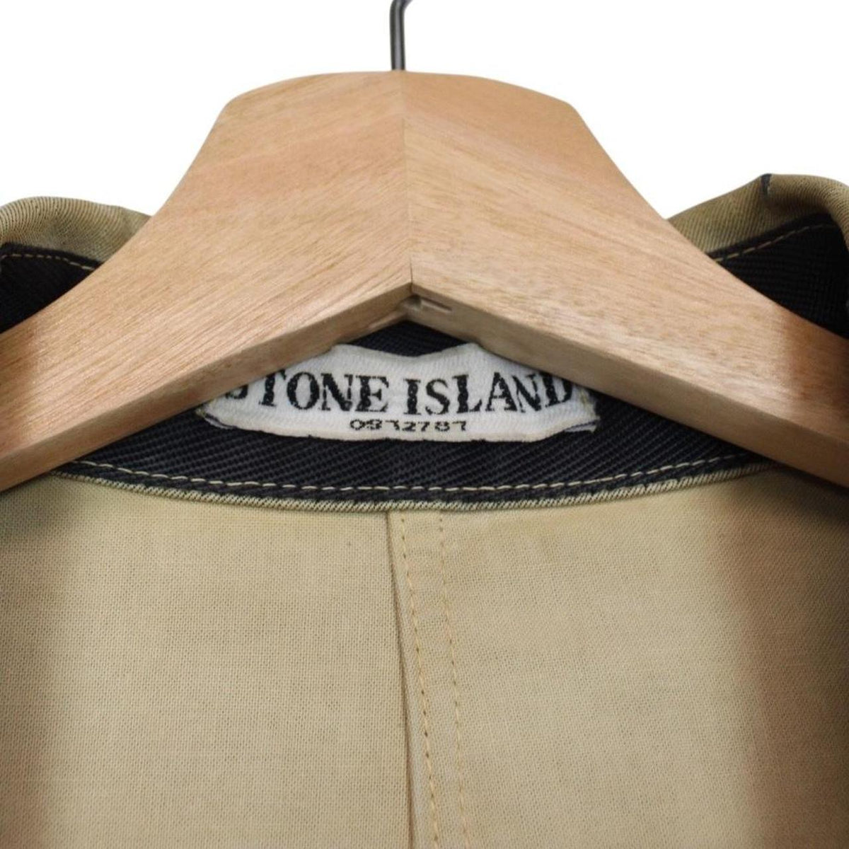 Stone Island beige multi-pocket jacket with logo patch and linen material.