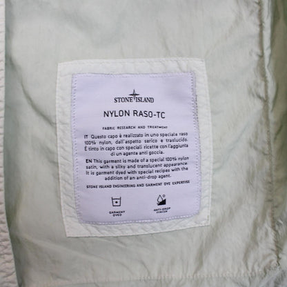 Stone Island mint green multi pocket jacket with logo patch and nylon material.