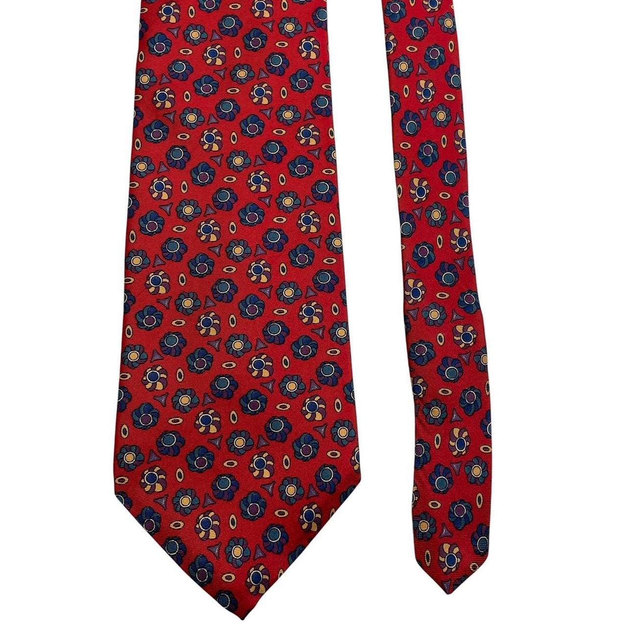Christian Dior multicoloured silk tie featuring intricate patterns and luxurious sheen.