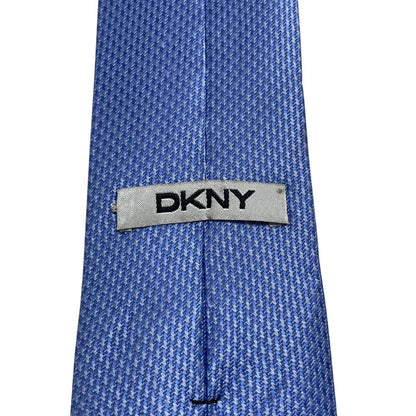 DKNY blue silk tie with subtle sheen and classic design.