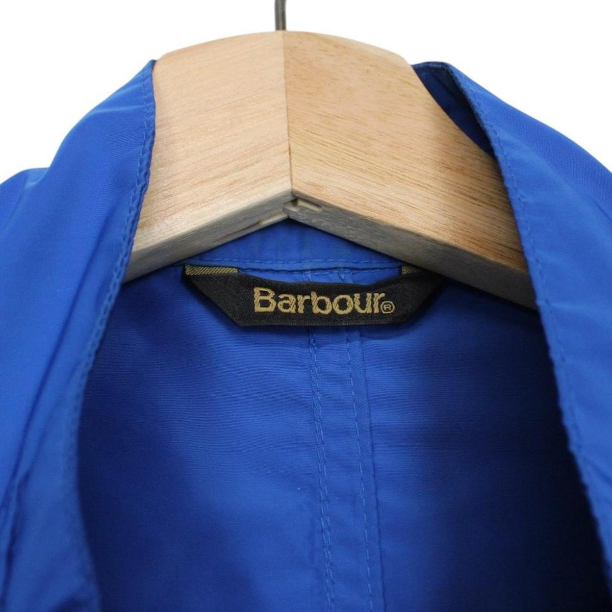 Barbour blue nylon multi-pocket jacket with logo detailing and scuff on bottom right pocket.