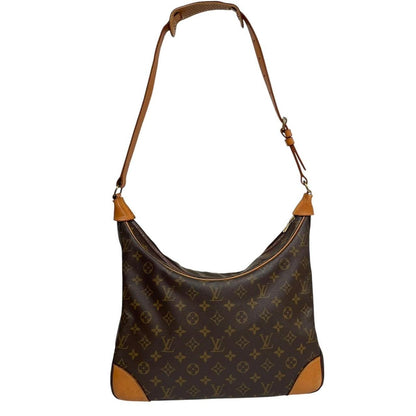 Louis Vuitton brown and tan monogram canvas duffel bag with leather accents and logo.
