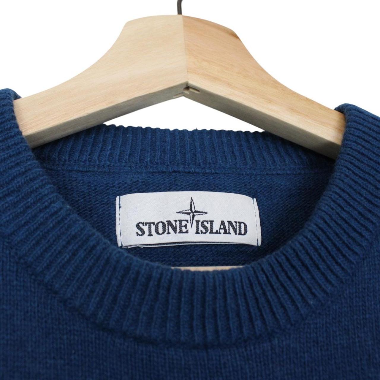 Stone Island blue wool knit jumper with logo patch and ribbed cuffs.