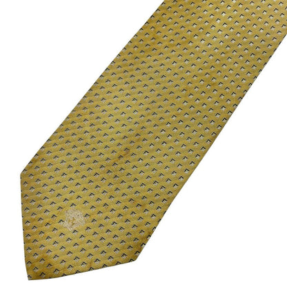 Versace yellow silk tie with subtle pattern and faint mark on front.