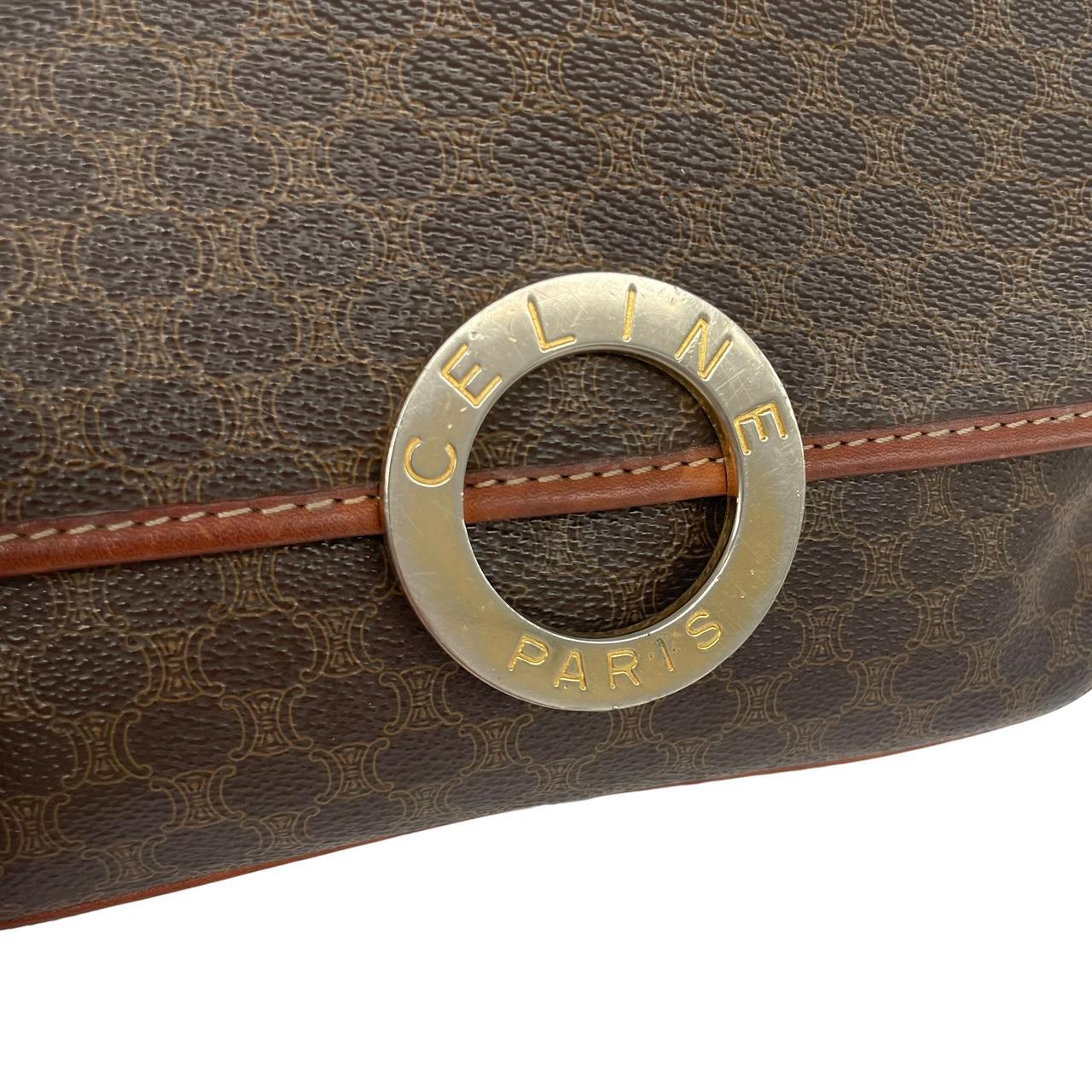 CELINE brown duffel bag with Macadam canvas pattern and logo detail.