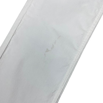 Stone Island white slim fit cotton trousers with logo patch and front mark.
