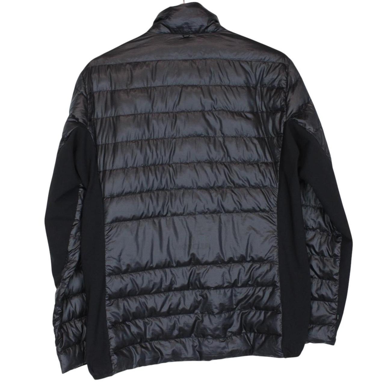 Moncler black lightweight down jacket with full zip and logo patch on sleeve.