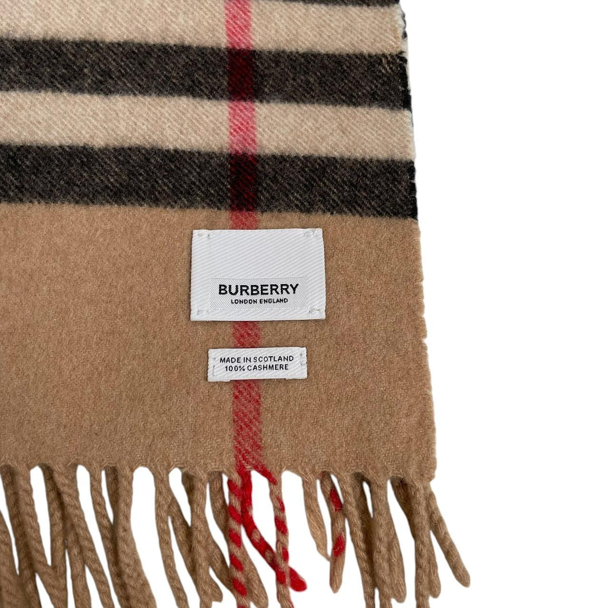 Burberry beige cashmere scarf featuring classic Nova Check pattern and logo.