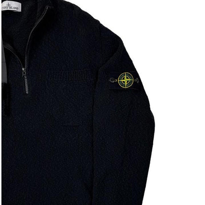 Stone Island black knit jumper with logo patch and cotton-linen blend material.