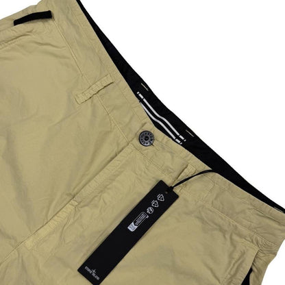 Stone Island beige cargo shorts with logo patch and multiple pockets in cotton material.