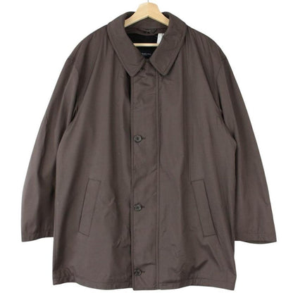 Burberry brown quilted coat featuring iconic Nova Check pattern and removable wool lining.