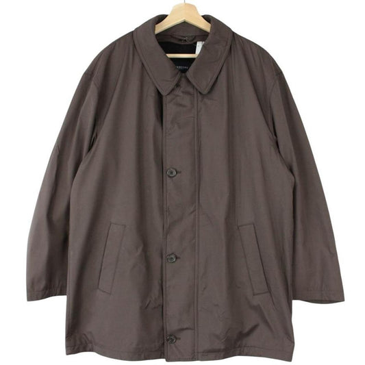 Burberry brown quilted coat featuring iconic Nova Check pattern and removable wool lining.