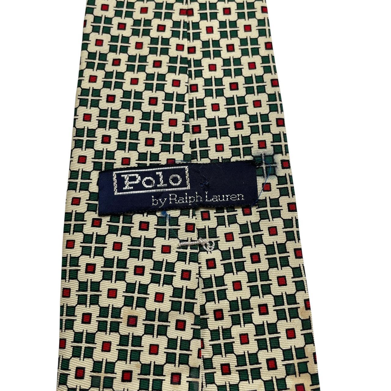 Polo Ralph Lauren yellow silk tie with geometric print design and logo detail.