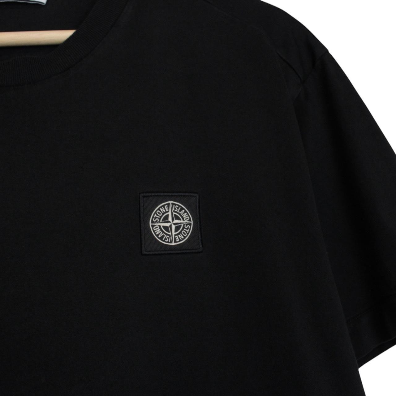 Stone Island black short sleeve t-shirt with compass logo and pocket detail.