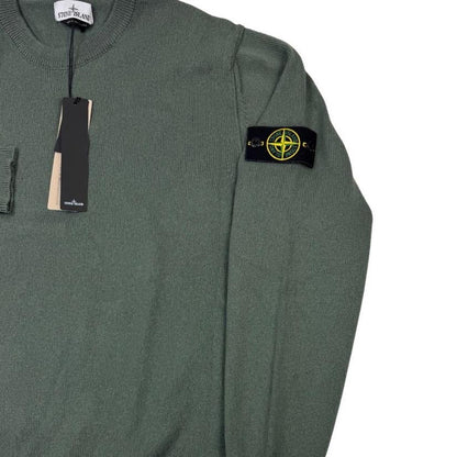 Stone Island green knit jumper made from organic cotton with logo patch detail.