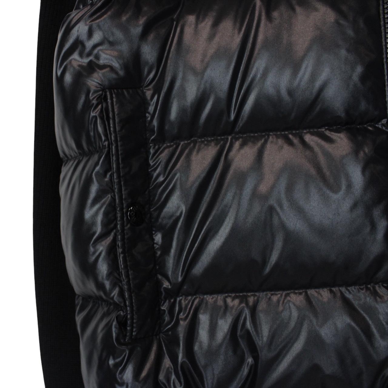 Moncler black cardigan jacket with full zip, wool/nylon blend, and logo detail.
