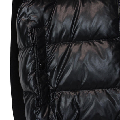 Moncler black cardigan jacket with full zip, wool/nylon blend, and logo detail.