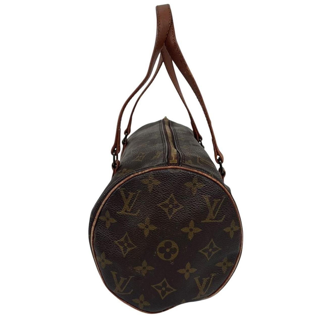 Louis Vuitton duffel bag brown and tan monogram canvas with logo pattern and wear.