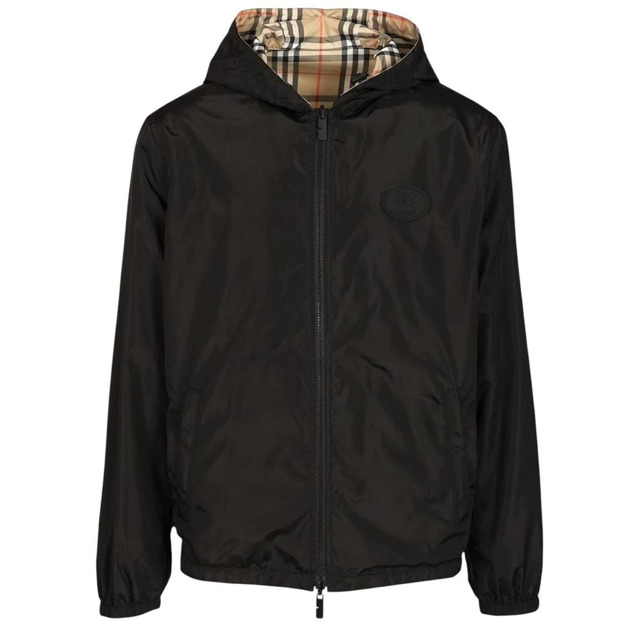 Burberry reversible windbreaker jacket in sand beige and black Nova Check pattern.