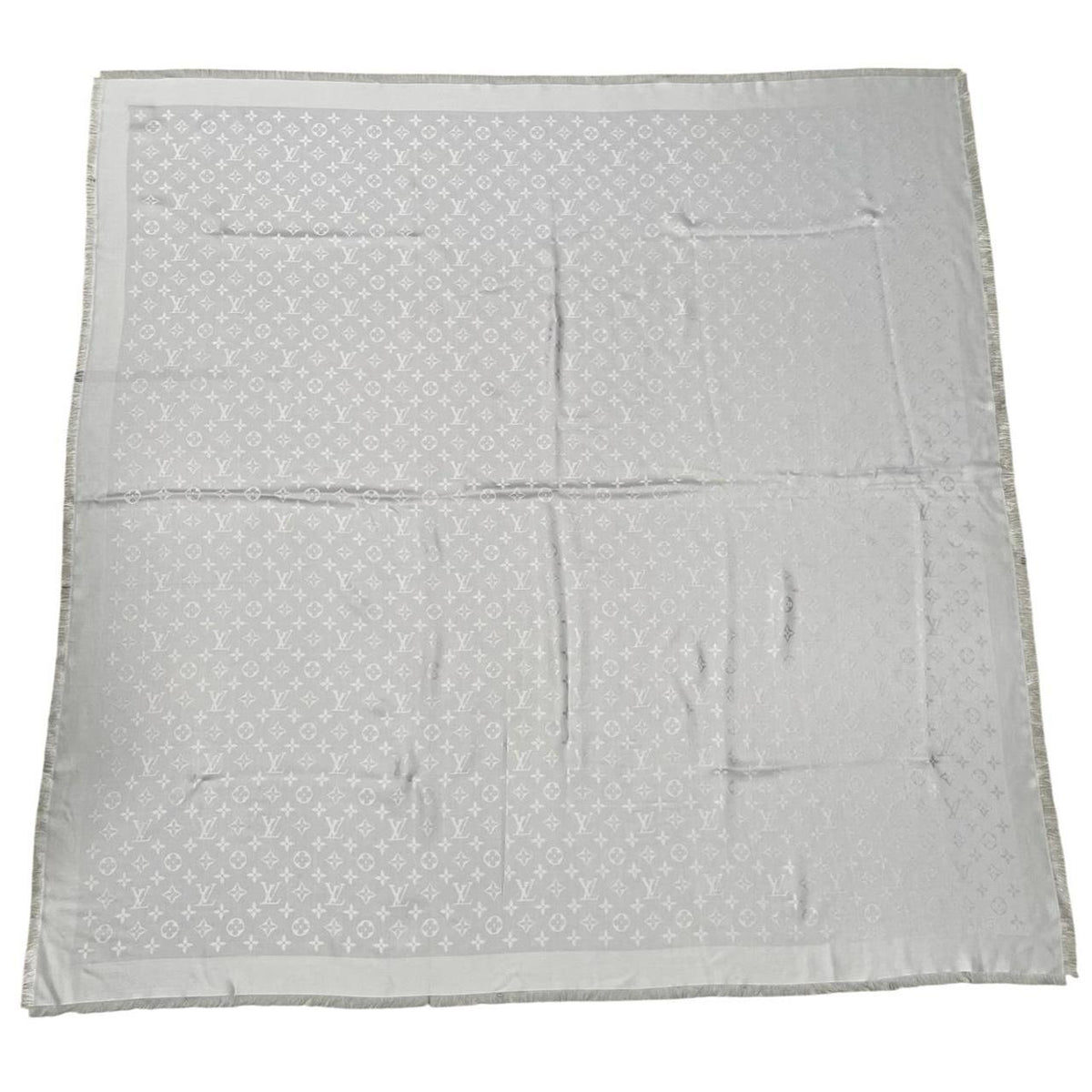 Louis Vuitton grey shawl scarf with LV monogram pattern in silk and wool blend.