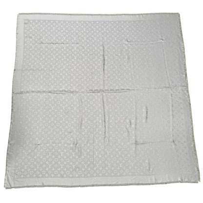 Louis Vuitton grey shawl scarf with LV monogram pattern in silk and wool blend.