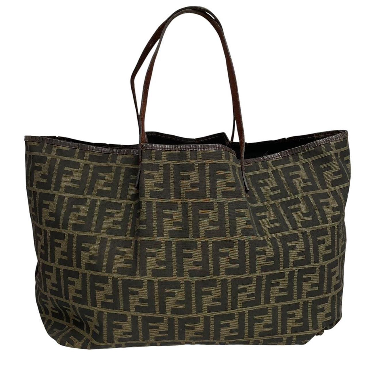 Fendi brown monogram canvas duffel bag with leather trim and logo detail.