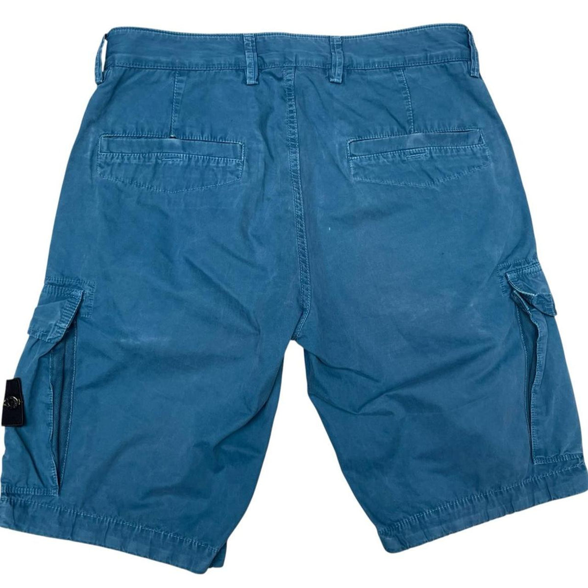 Stone Island teal blue cargo shorts with logo patch and cotton material.