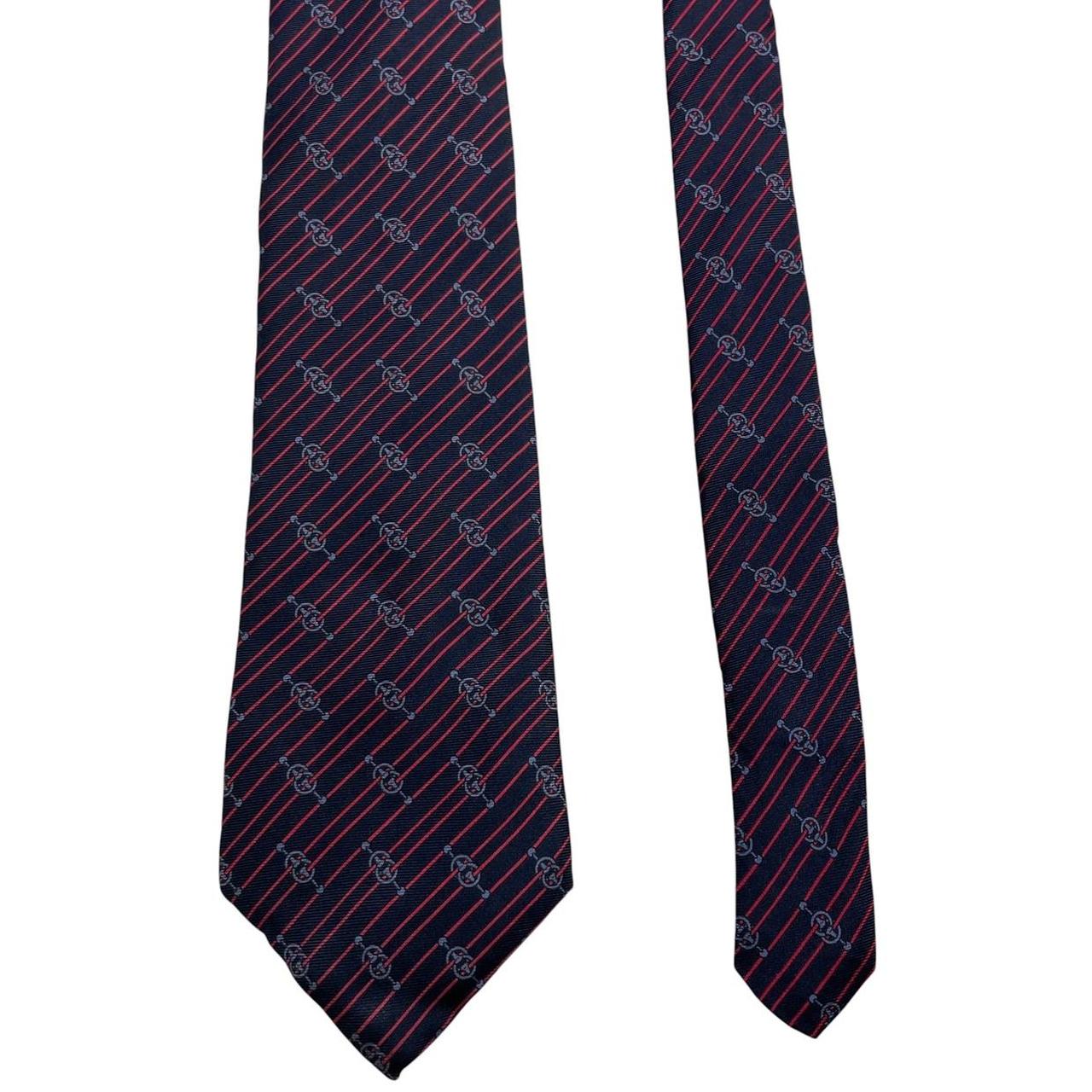 Yves Saint Laurent navy blue and red striped silk tie with logo detail.