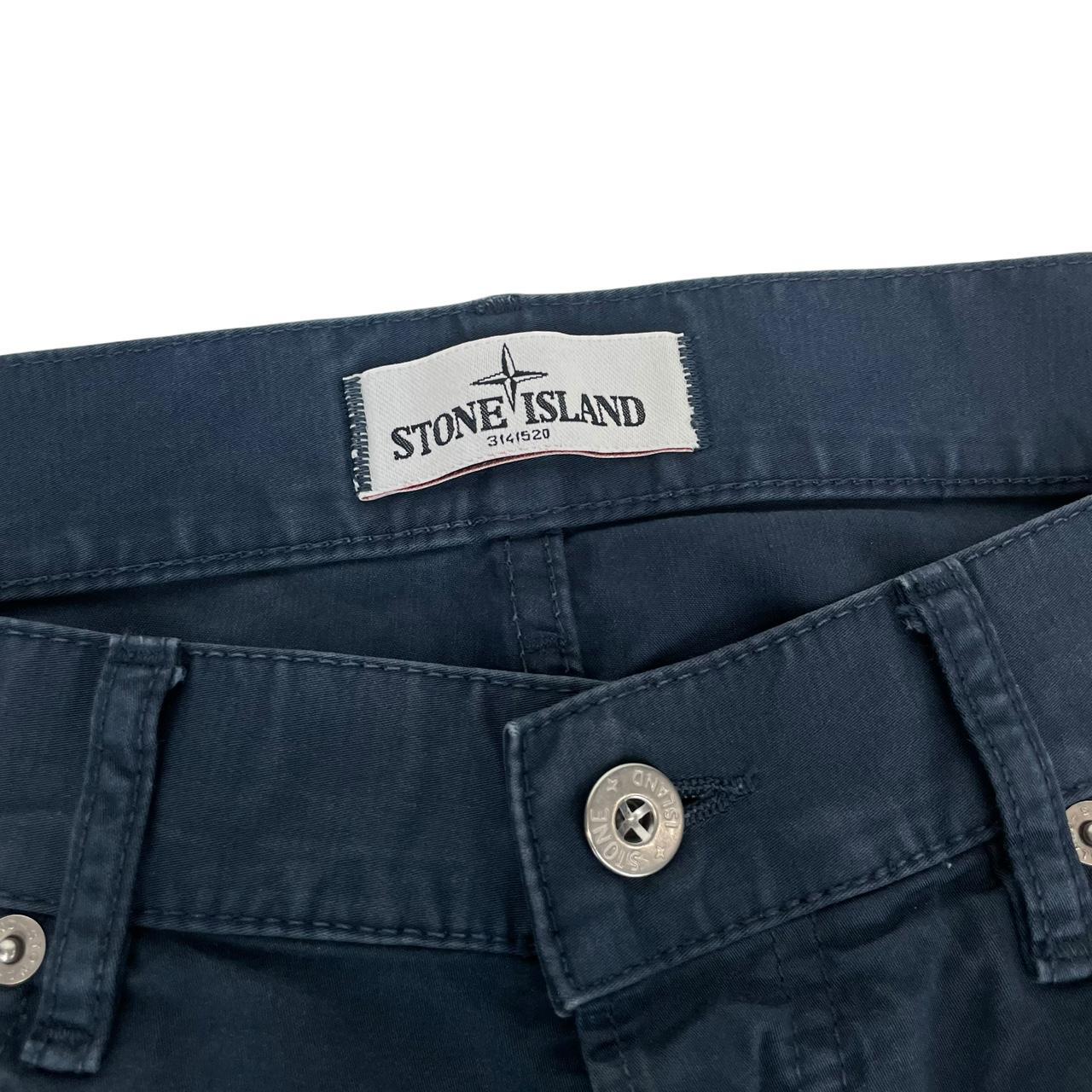 Stone Island navy blue trousers with RE-T fit, cotton material, and iconic compass logo.