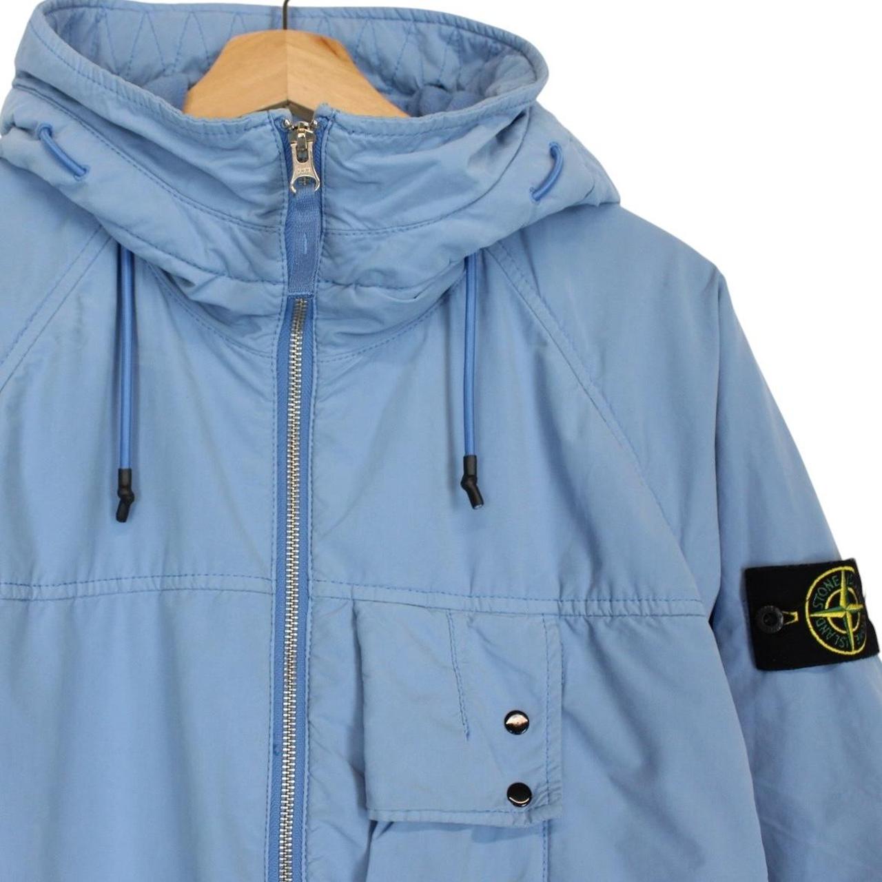 Stone Island blue jacket with logo patch and micropile texture, size small.