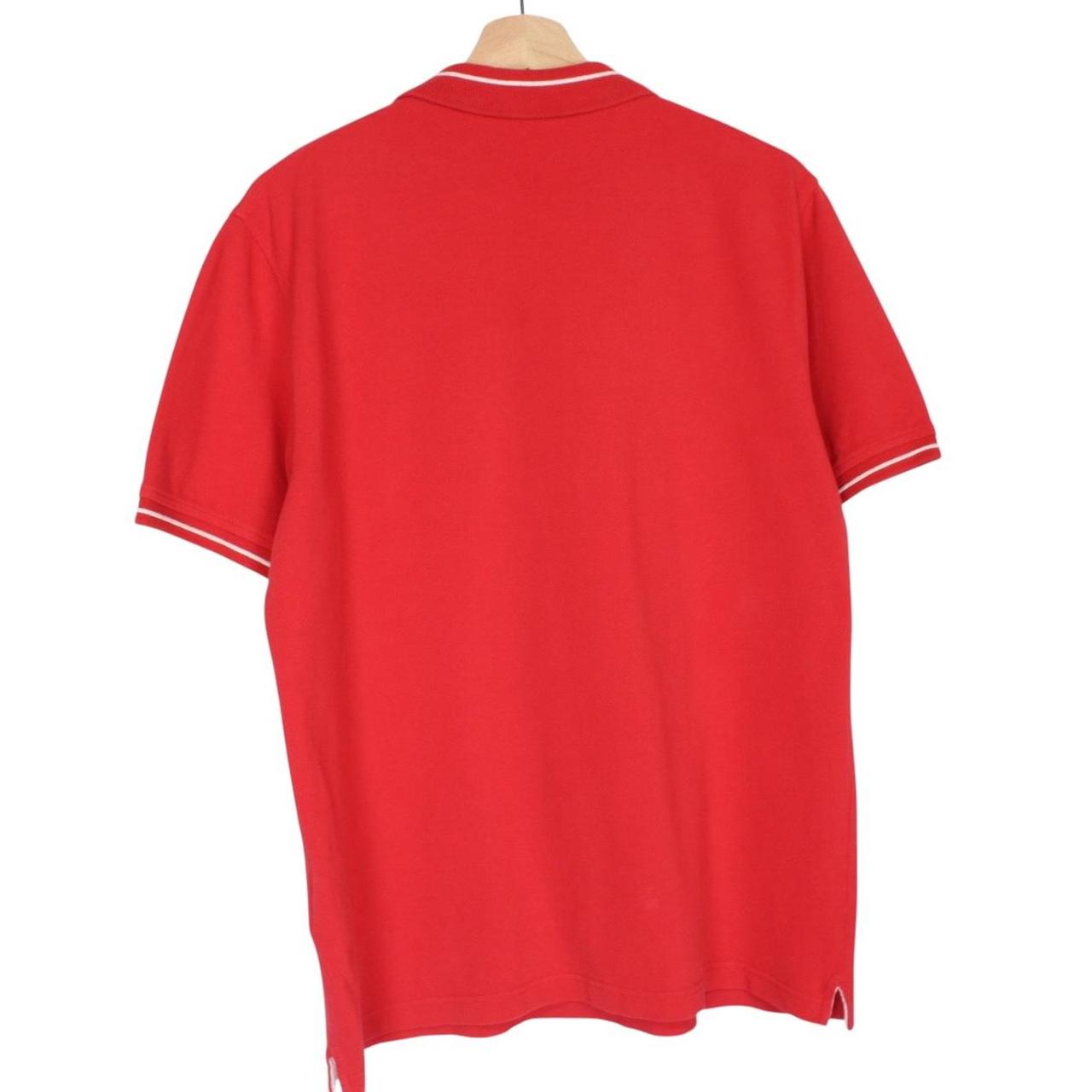 Lyle & Scott red short sleeve polo shirt with embroidered logo and cotton material.