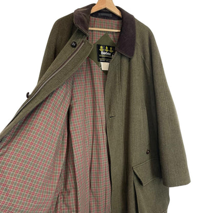 Barbour green tweed wool coat with classic pattern and missing front pocket button.