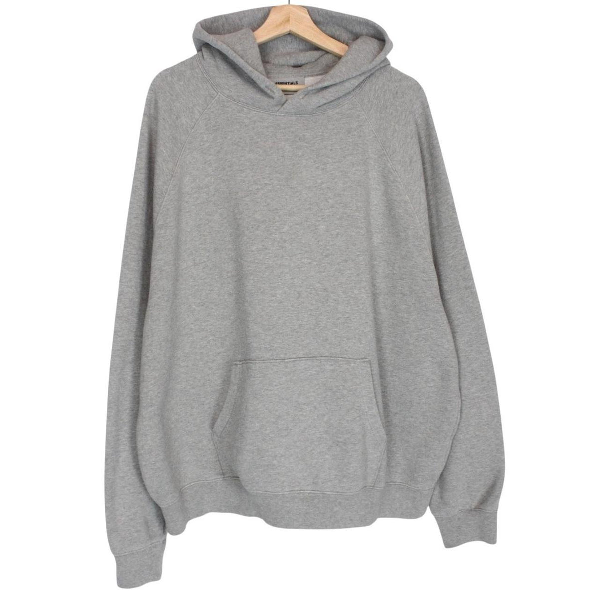 Essentials grey hoodie jumper with oversized fit and subtle logo detail.